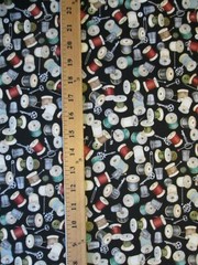 THREAD SPOOLS OF THIMBLE NEEDLES THREADER MORE ON BLACK COTTON FABRIC BTHY