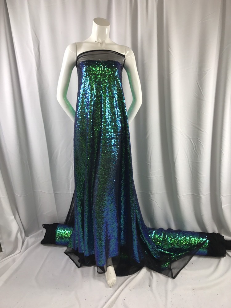 GREEN IRIDESCENT MINI SEQUINS EMBROIDER ON A BLACK MESH-FASHION-SOLD BY YARD.
