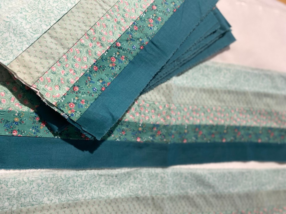 Set of 9 pieced quilt strips /4green floral,1 solid green in 7″ x 43″ strips