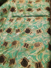 African Batik Fabric Metallic Gold & Black On Green Watercolor Fish Elephants