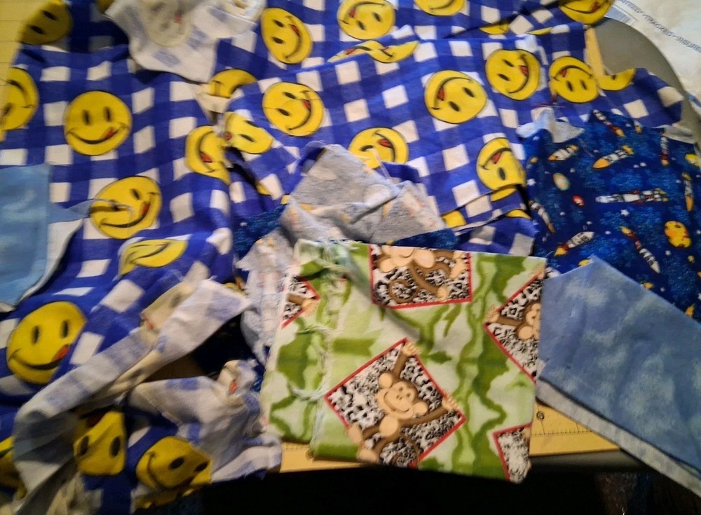 Lot H FLANNEL SMILEY FACES AND OTHER Flannel SCRAPS Various Sizes