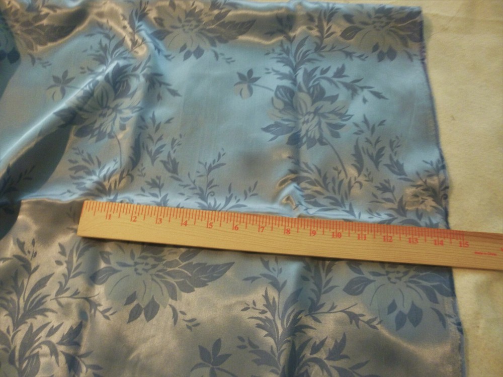 Light blue polyester / acetate fabric with large blue floral pattern -44″ by 54″