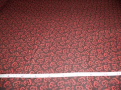 BLACK WITH RED FLORAL PRINT – – SOLD BY THE YARD –
