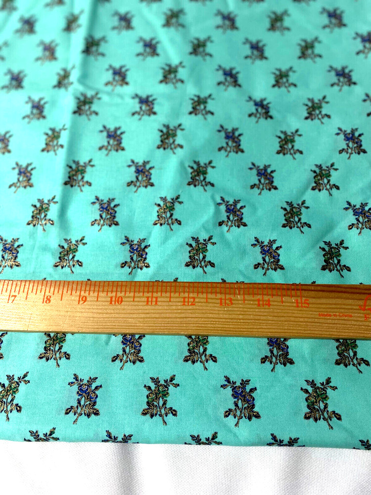 “Buttercream” cotton print fabric/metallic floral on light green 43″ x 44″