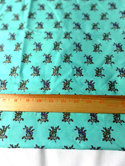 “Buttercream” cotton print fabric/metallic floral on light green 43″ x 44″