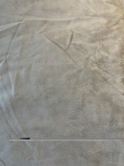 Beige Textured Faux Leather/Suede-Look Upholstery Fabric. Sold by the half yard.