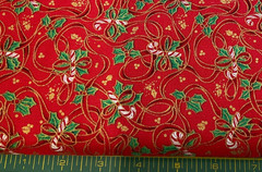 FABRI-QUILT – SEASON’S GREETINGS #709 CANDY CANES & RIBBONS ON RED COTTON- BTY
