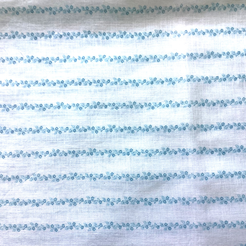 White fqbric with tiny blue flower stripes 24″ x 29″ $4