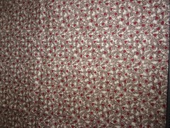 REMNANT OF FABRIC WITH WINE DESIGNS & TINY DARK RED HEARTS – 14 IN. L X 30″ W