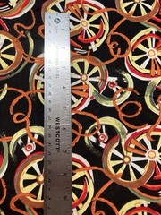 Cotton Fabric Wagon Wheels Avocado Yellow Red Orange on Black 2-7/8Y x 41″ W