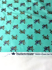 “Buttercream” cotton print fabric/metallic floral on light green 43″ x 44″