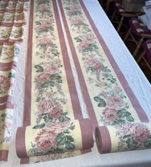 2 rolls ~150 total yds mauve cotton(?) 11″W floral border print fabric, +8 pcs