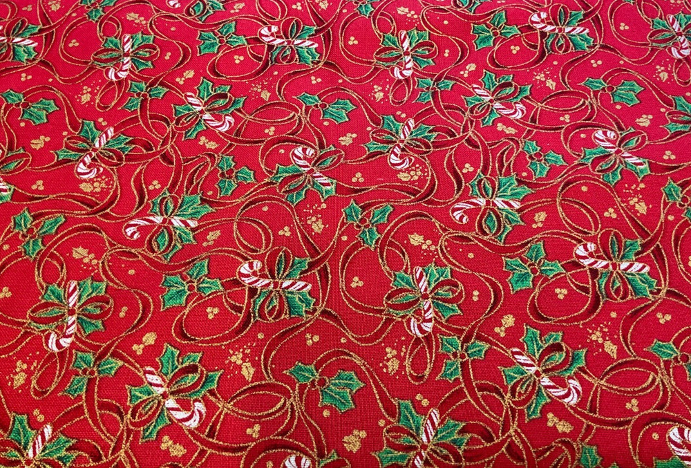 FABRI-QUILT – SEASON’S GREETINGS #709 CANDY CANES & RIBBONS ON RED COTTON- BTY
