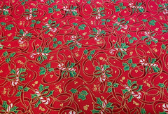 FABRI-QUILT – SEASON’S GREETINGS #709 CANDY CANES & RIBBONS ON RED COTTON- BTY