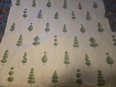 Osborne & Little Secret Garden Fabric Green Topiaries Beige Background 44″x 64″