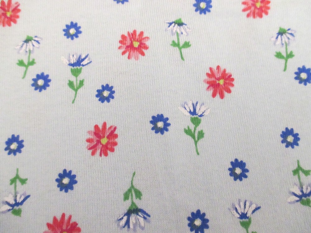 Stretch knit synthetic apparel fabric Red B;ue floral On Light Blue 1yd 22″ x 58