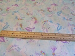 Pale Blue With Pastel Colored Unicorns Cotton Fabric BTY
