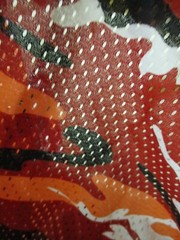 One-Way Stretch Mesh Fabric – Camo – Red, Orange, Black, White – 62″ W x 24.5″