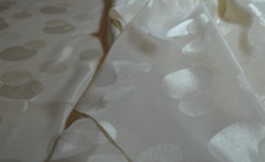 cream polyester jacquard fabric, circles 90 L” x 44″ W (2.5 yds)