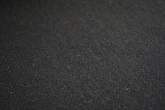 Tweed material by the metre or yard in plain black with Herringbone pattern