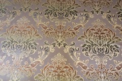 Damask medallion scroll upholstery material in taupe/brown/gold multi on taupe