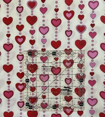 “Love Me Do” Red and Pink Beaded Hearts on White Valentine Fabric