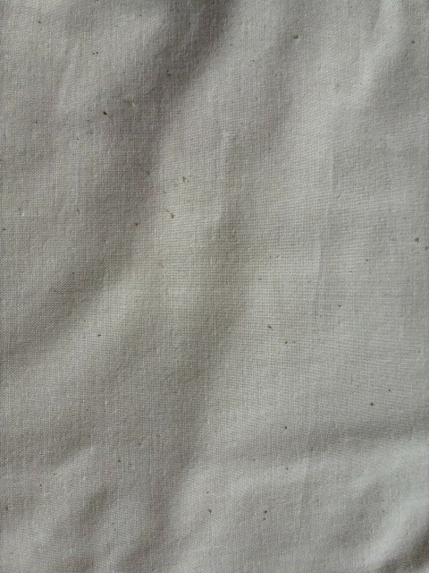 Unbleached Muslin Fabric 5 yards undyed surface with a natural cream color