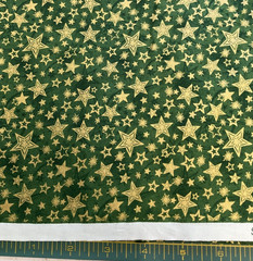 FABRI-QUILT -SEASON’S GREETINGS #103-220-METALLIC GOLD STARS ON GREEN- BY THE YD