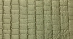 100% silk dupioni padded and quilted in rectangle design by Scalamandre 8044