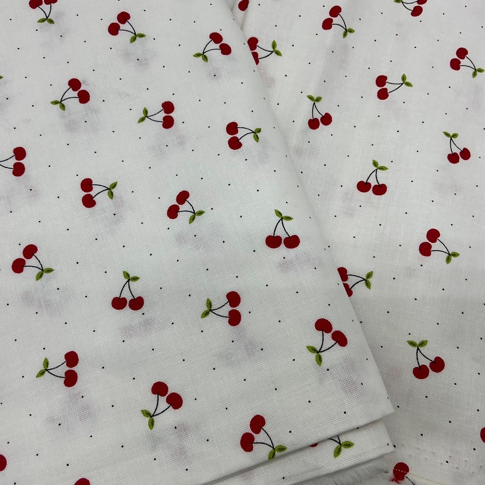 Red Cherries with Green Leaves on White with small Polka Dots Background