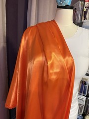 Orange Satin, Polyester , 45” Width. Great For Costumes