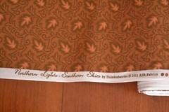 By 1/2 Yd, Orange on Brown, Thimbleberries/Northern Lights – Southern Skies, B88