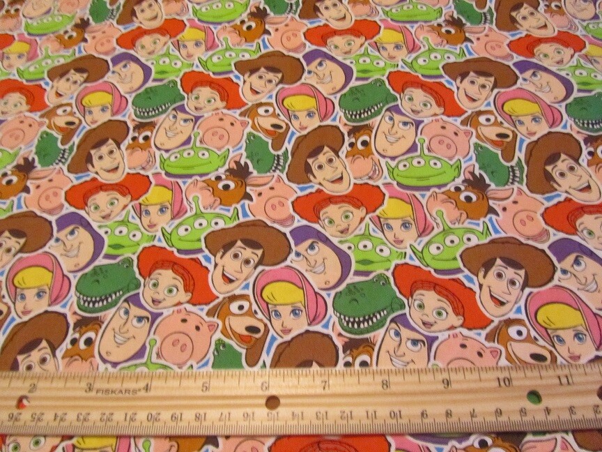 Multicolored Packed Toy Story Character Faces Cotton Fabric BTY